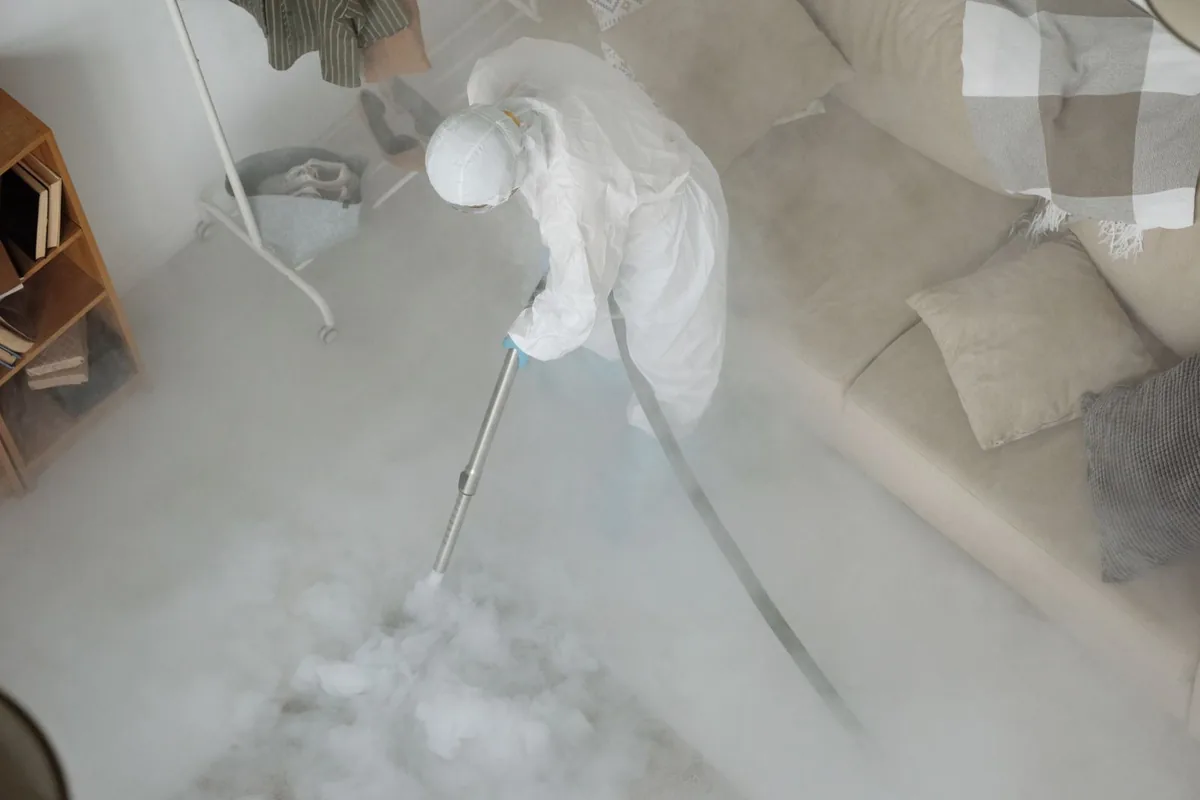 Biohazard cleanup technician in protective equipment, Anniston, AL